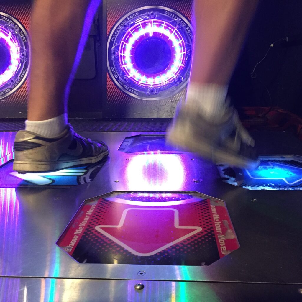 Sneakers stepping on glowing arrow panels