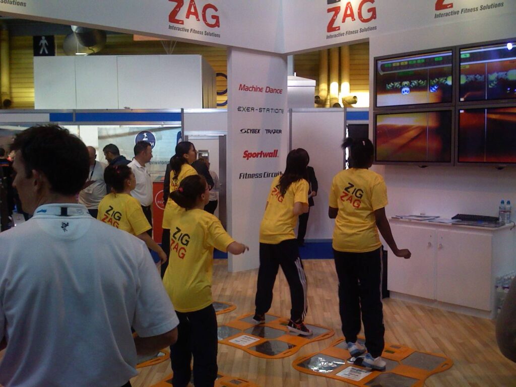 Kids step on a floor exergame together
