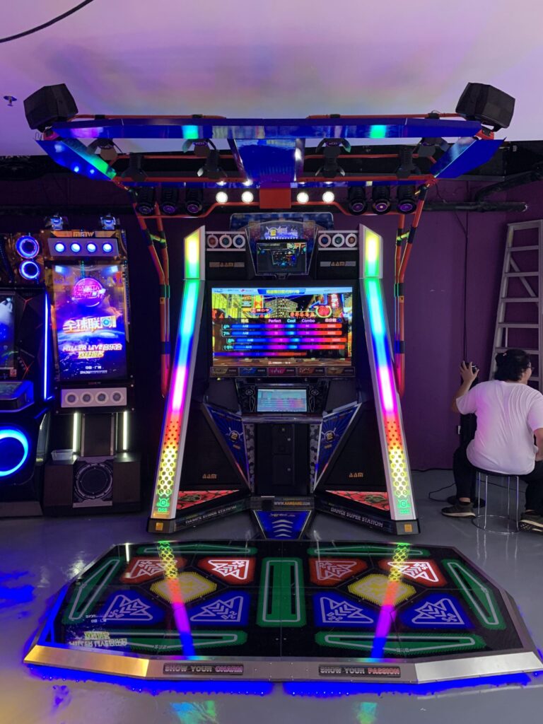 A brightly lit dance-game cabinet